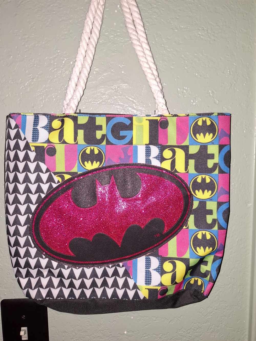 DC Comics canvas Batgirl tote bag featuring a prominent pink glitter Batgirl...